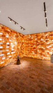 Pink salt tile wall in luxury spa room Australia, glowing salt bricks interior design wellness salt therapy room wholesale salt tiles supply
